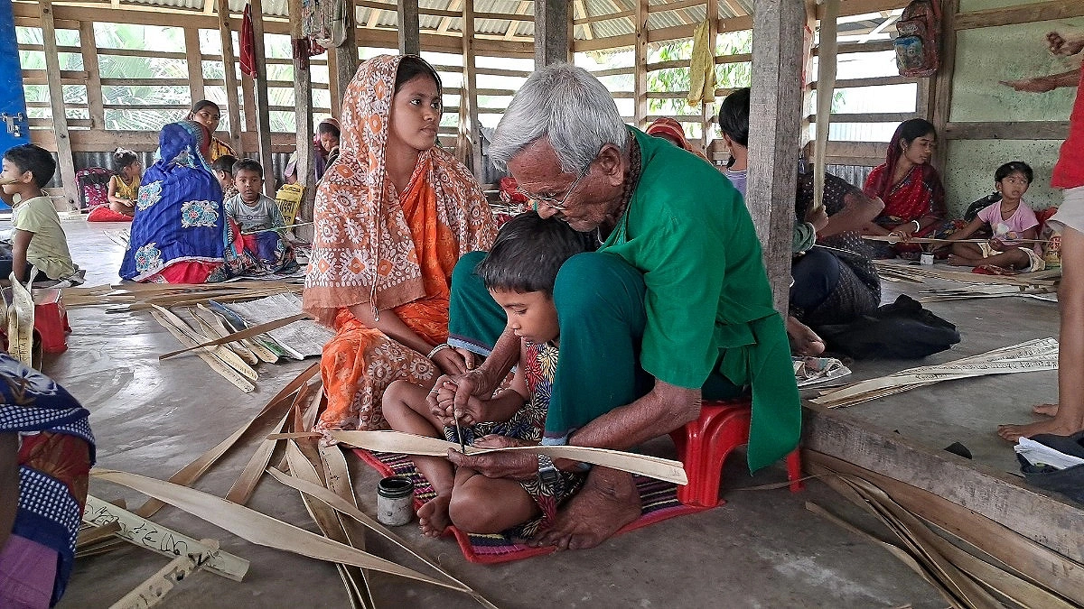 A traditional school where children learn their first letters using palm leaves, ink