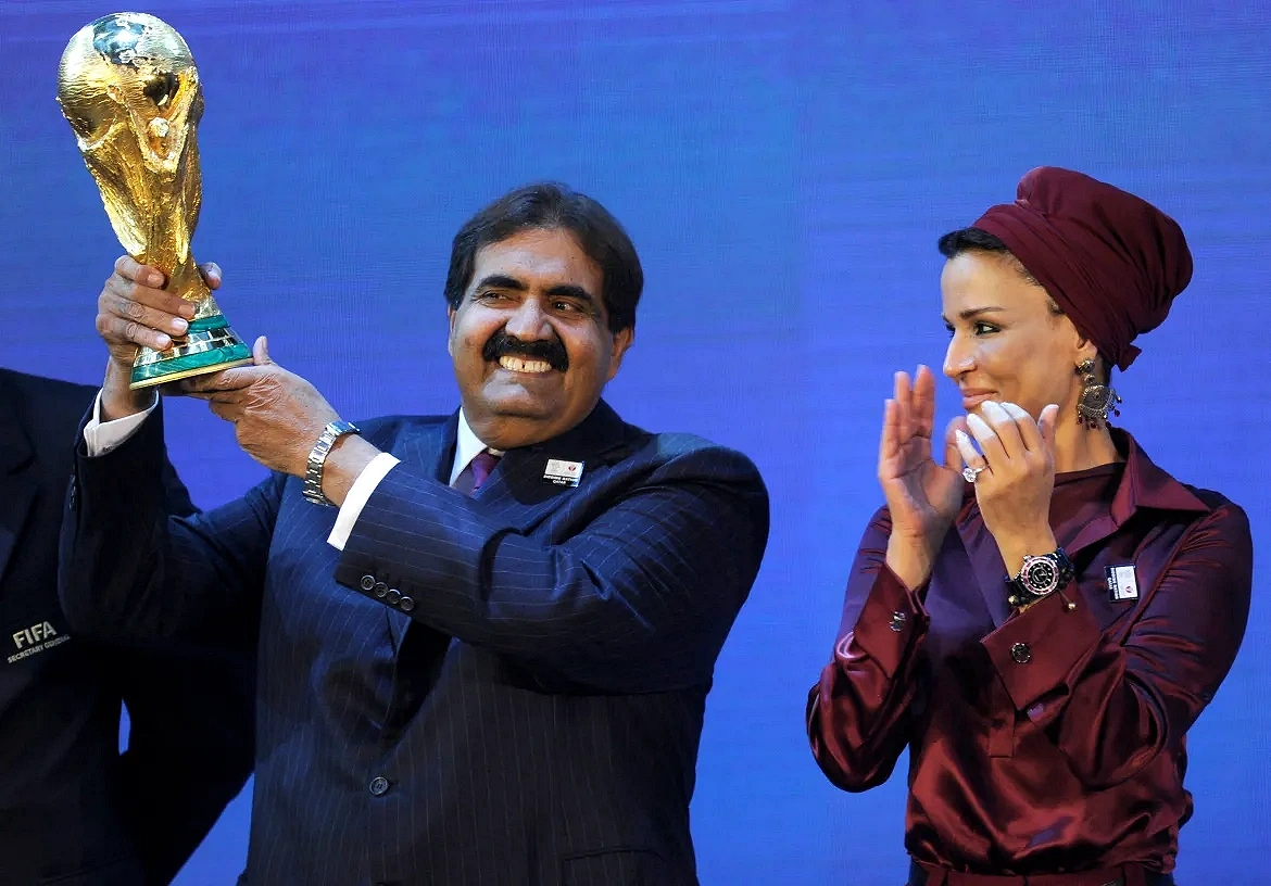 Sheikh Hamad bin Khalifa Al Thani holds up the FIFA World Cup trophy after Qatar was named host of the tournament at FIFA headquarters on December 2, 2010.